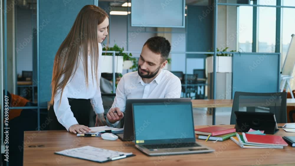Affectionate lovely look. Man and woman employees are working in the office. Affectionate lovely look. Man and woman employees are working in the office.
