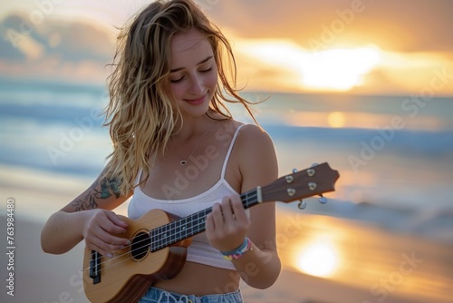 A happy young woman playing the cavaquinho on the beach, concept of leisure and music. photo