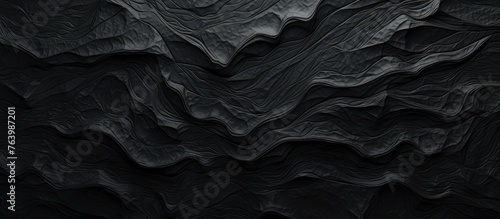 A detailed closeup of a black and white automotive tire painting on a dark background, showcasing a monochrome pattern with a touch of darkness