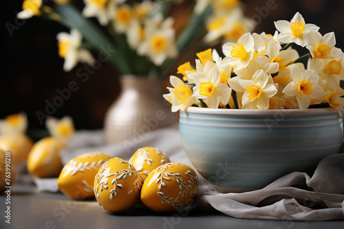 Easter holiday banner with Easter eggs in a bowl and yellow daffodil flowers on the table photo