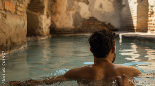 A Roman bathes in the thermal baths in Rome in ancient times.
