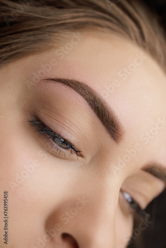 Photo of eyebrows after correction of permanent makeup. Second PMU procedure in a month of permanent eyebrow makeup. Permanent makeup correction. photo