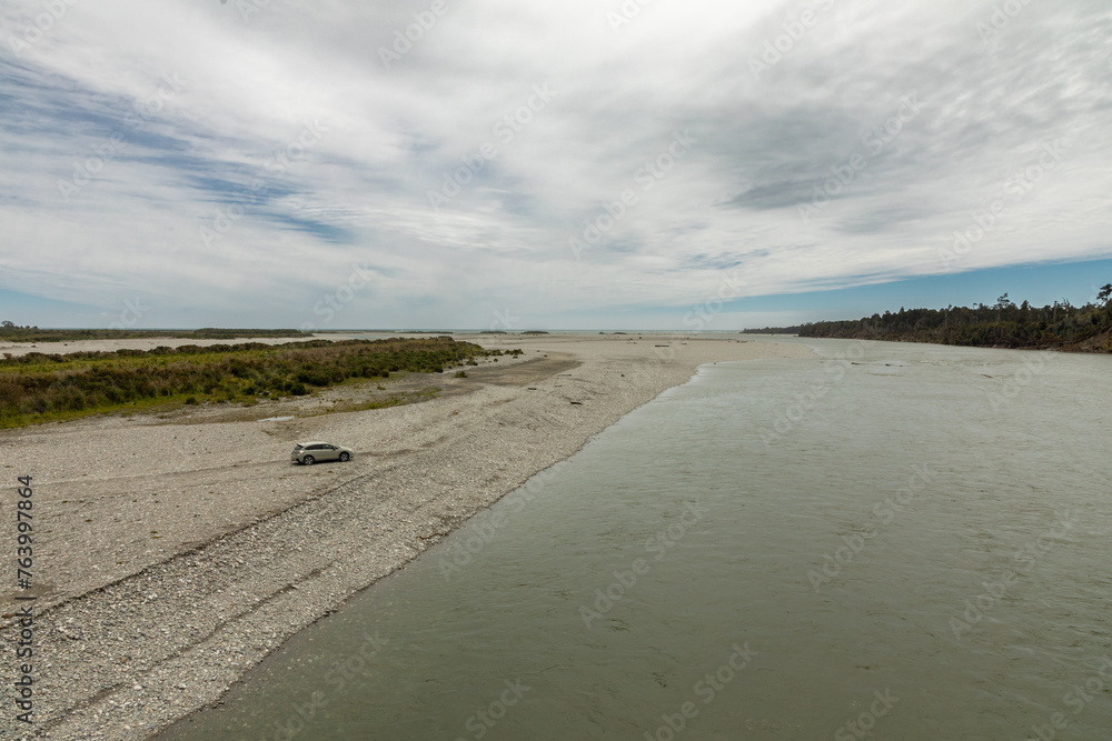 The mouth of the Haast river, with the Tasman Sea in the distance, in the Westland district of the South Island of New Zealand.