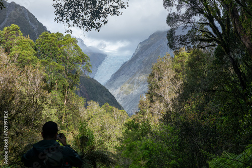 Cloud descends on the shrinking Fox glacier on the west coast of the South Island of New Zealand. photo