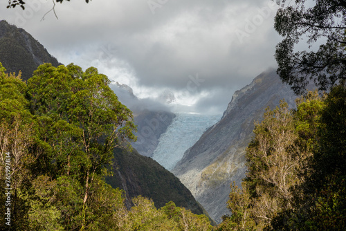 Cloud descends on the shrinking Fox glacier on the west coast of the South Island of New Zealand. photo