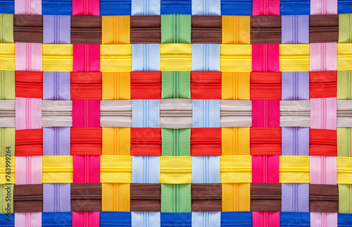 Multicolored Zippers or Zip Fasteners used for binding fabric or textile © Roberto Sorin