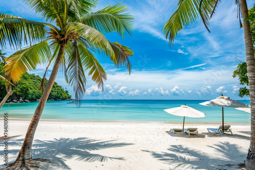 White sand on the beach and turquoise sea, Palm trees and sun umbrellas on the shore, a view of an exotic beach in the tropical Maldives. Travel agency and travel