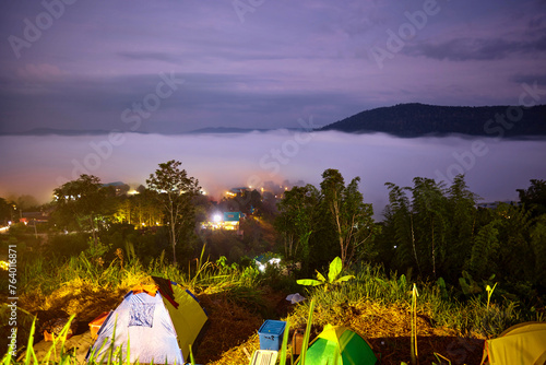 Traveler camping in the mountains with misty morning © Anucha