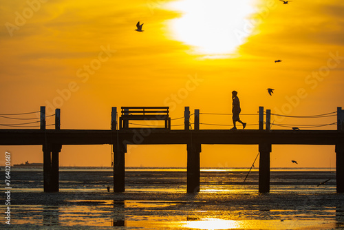 The nature of beautiful, bridge on the sea and suntset photo