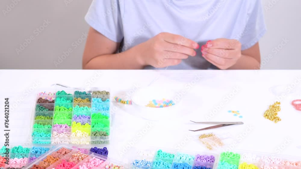 Young Girl Engrossed in Crafting with Colorful Clay Beads Young Girl Engrossed in Crafting with Colorful Clay Beads