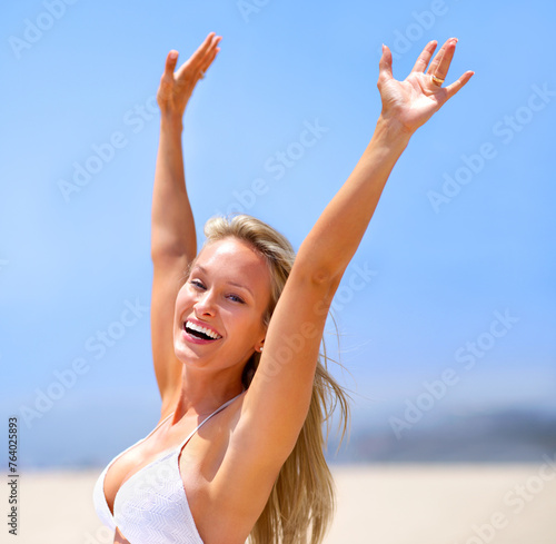 Woman, beach and portrait on vacation, travel and excited satisfaction for sand and ocean. Happy female person, arms stretch and freedom for holiday on weekend, nature and relax on tropical island