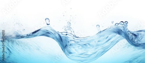 A close-up image of a single wave of water flowing on a light blue background
