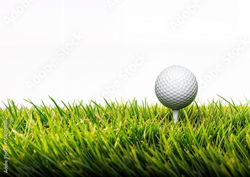 Golf ball on green grass isolated on white background with copy space