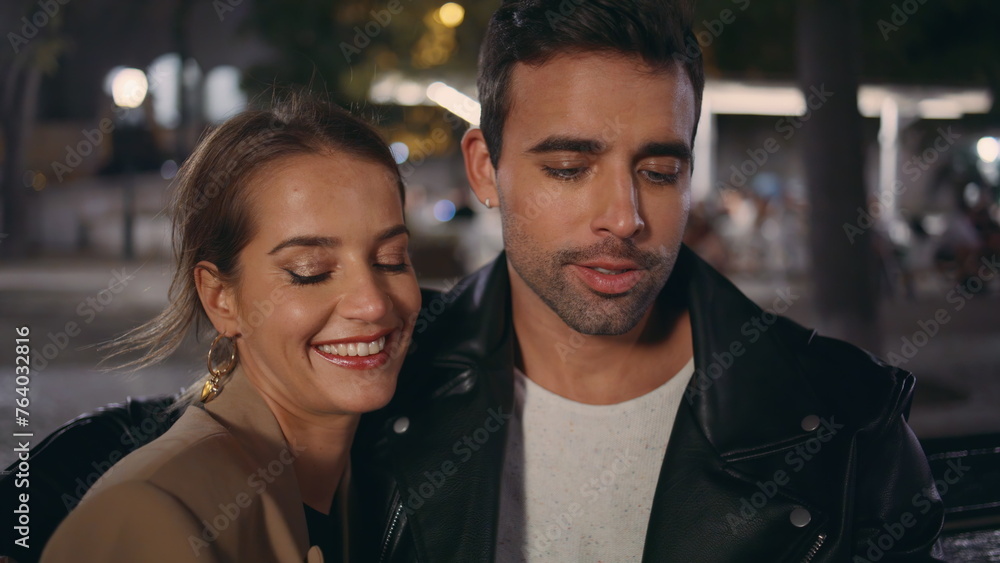 Amorous people talking evening date on street closeup. Relaxed lovers resting Amorous people talking evening date on street closeup. Relaxed lovers resting