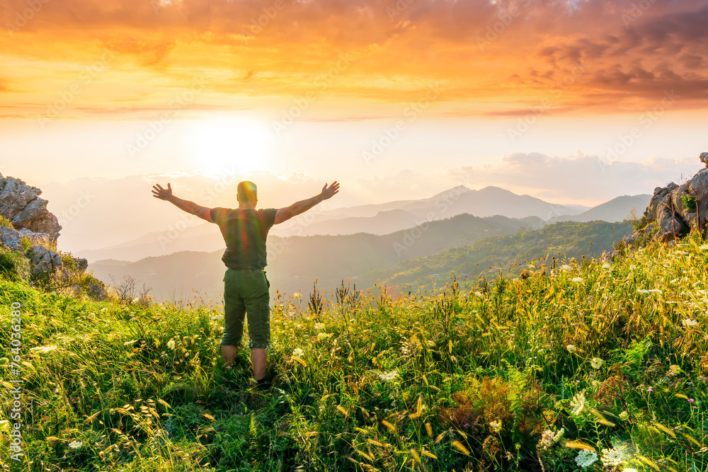 happy man watching amazing highland evening sunset, person delight with nature landscape happy man watching amazing highland evening sunset, person delight with nature landscape