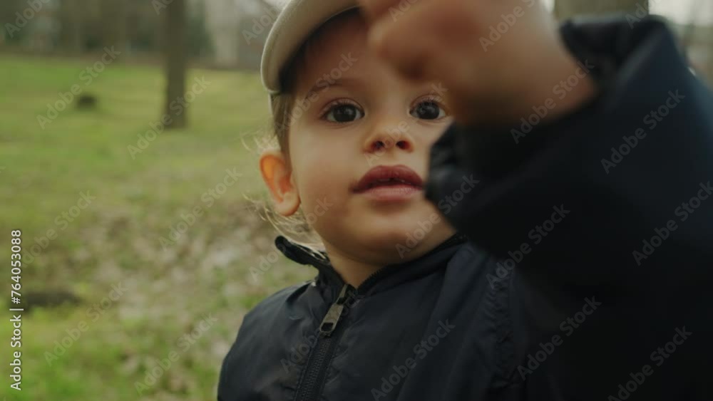 Cute little girl in the autumn park holding a yellow leaf, walking. Family time, autumn mood. Fresh air walking. Lonely children. Cute little girl in the autumn park holding a yellow leaf, walking. Family time, autumn mood. Fresh air walking. Lonely children.