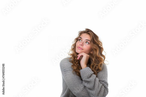 Beautiful woman thinking about question, pensive expression, wearing gray sweater with hand on chin, isolated on white