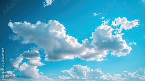 Clear blue sky with fluffy clouds, symbolizing optimism, clarity, and endless possibilities© Tumelo