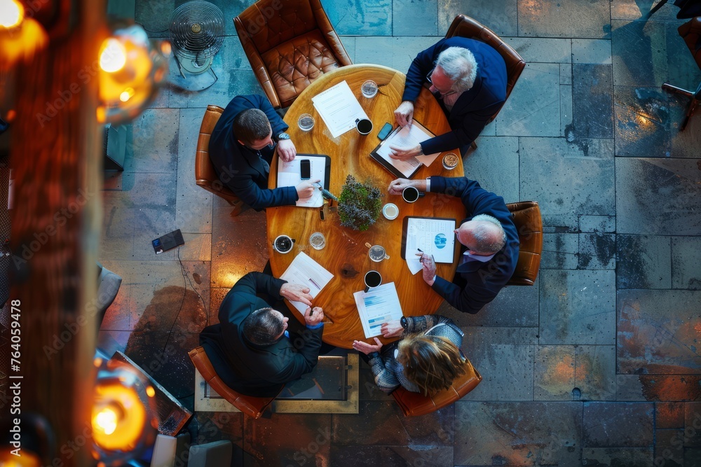 Business Meeting Overhead View, Investment Discussion on a Wooden Table