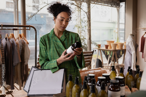Environmentally conscious shopper checking the ingredients in a beauty product