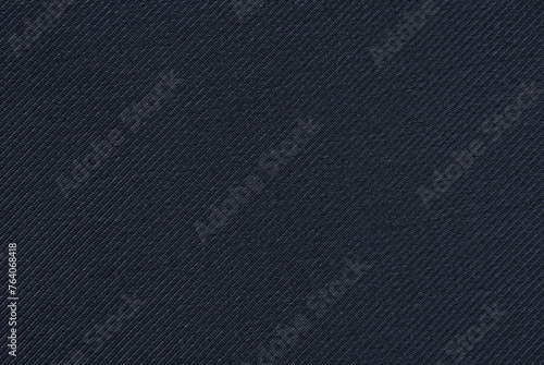 Dark blue cotton twill fabric pattern close up as background © Irina