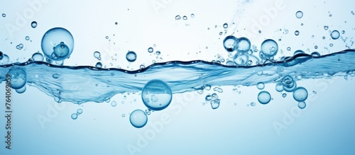 The image showcases a close-up view of water bubbles being released from the surface