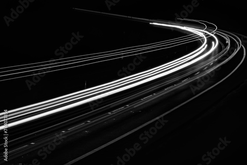 white lines of car lights on black background