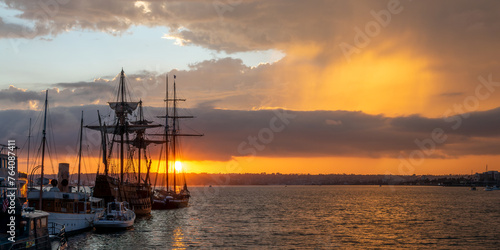 Fototapeta Naklejka Na Ścianę i Meble -  Historic sailing ships in San Diego maritime museum at sunset, California