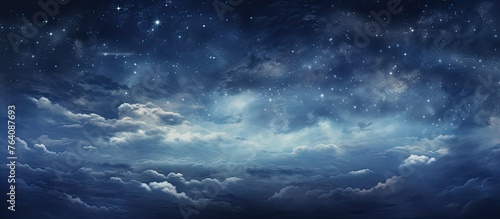 A scenic view of a night sky with a deep blue hue, featuring twinkling stars scattered amidst soft white clouds