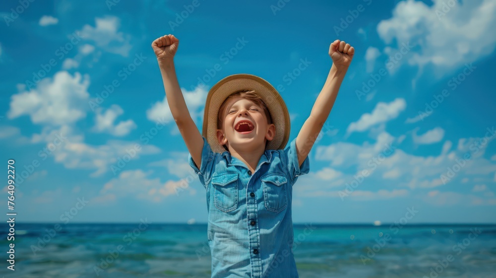 A child with arms raised in victory stands by the sea, wearing a straw hat and blue shirt, embodying freedom and joy A child with arms raised in victory stands by the sea, wearing a straw hat and blue shirt, embodying freedom and joy