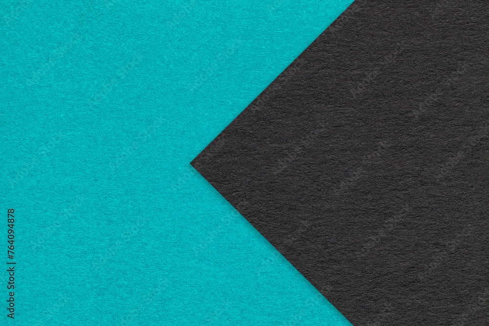 Texture of cerulean paper background, half two colors with black arrow, macro. Craft blue and turquoise cardboard. Texture of cerulean paper background, half two colors with black arrow, macro. Craft blue and turquoise cardboard.