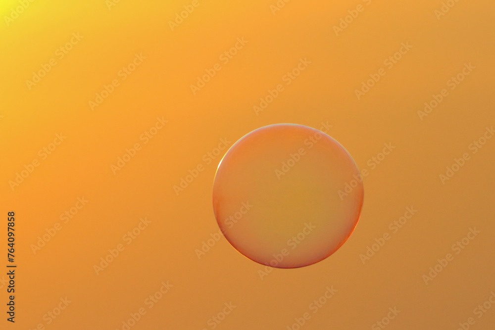 Soap bubbles floating in the air during sunset. Soap bubbles floating in the air during sunset.