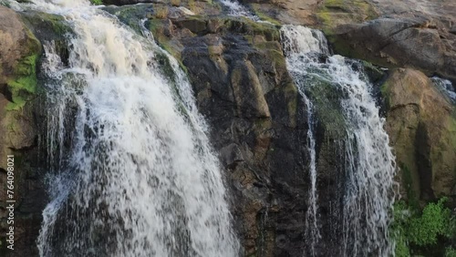 Beautiful Waterfalls in gir forest. waterfall mountain river in the dhari saurashtra in gujarat , with lush green tropical rainforest jungle. Wonderful freshwater rapids waterfalls river flowing. photo