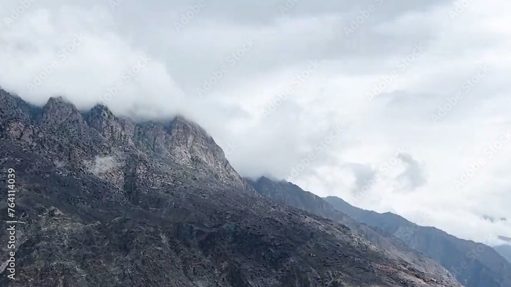 clouds over the mountain  Mountain top blue sky dark white clouds 