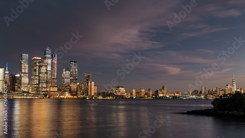 Panoramic skyline and modern commercial buildings. Cityscape of Manhattan NYC at sunset. High-quality photo