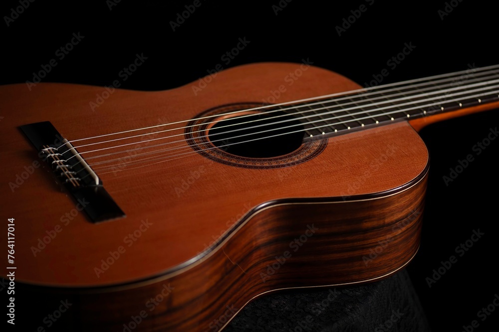 Classical Spanish flamenco guitar close up, dramatically lit isolated on black background with copy space. Classical Spanish flamenco guitar close up, dramatically lit isolated on black background with copy space.