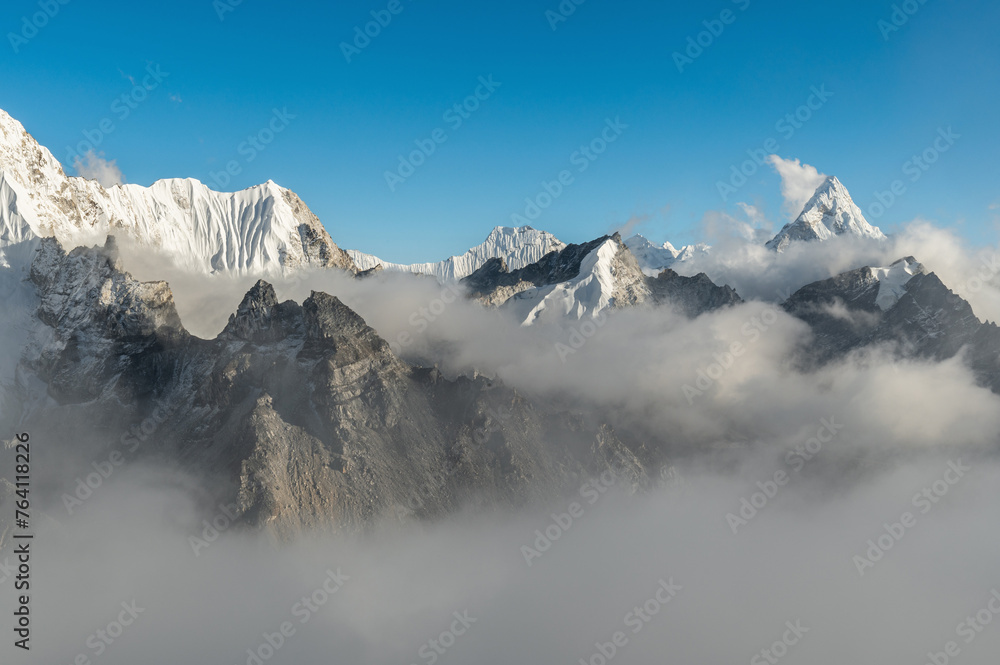 View of Ama Dablam and Pema Dablam in clouds at sunset from Kala Pattar during Everest Base Camp trekking in Nepal. Highest mountain in the world.