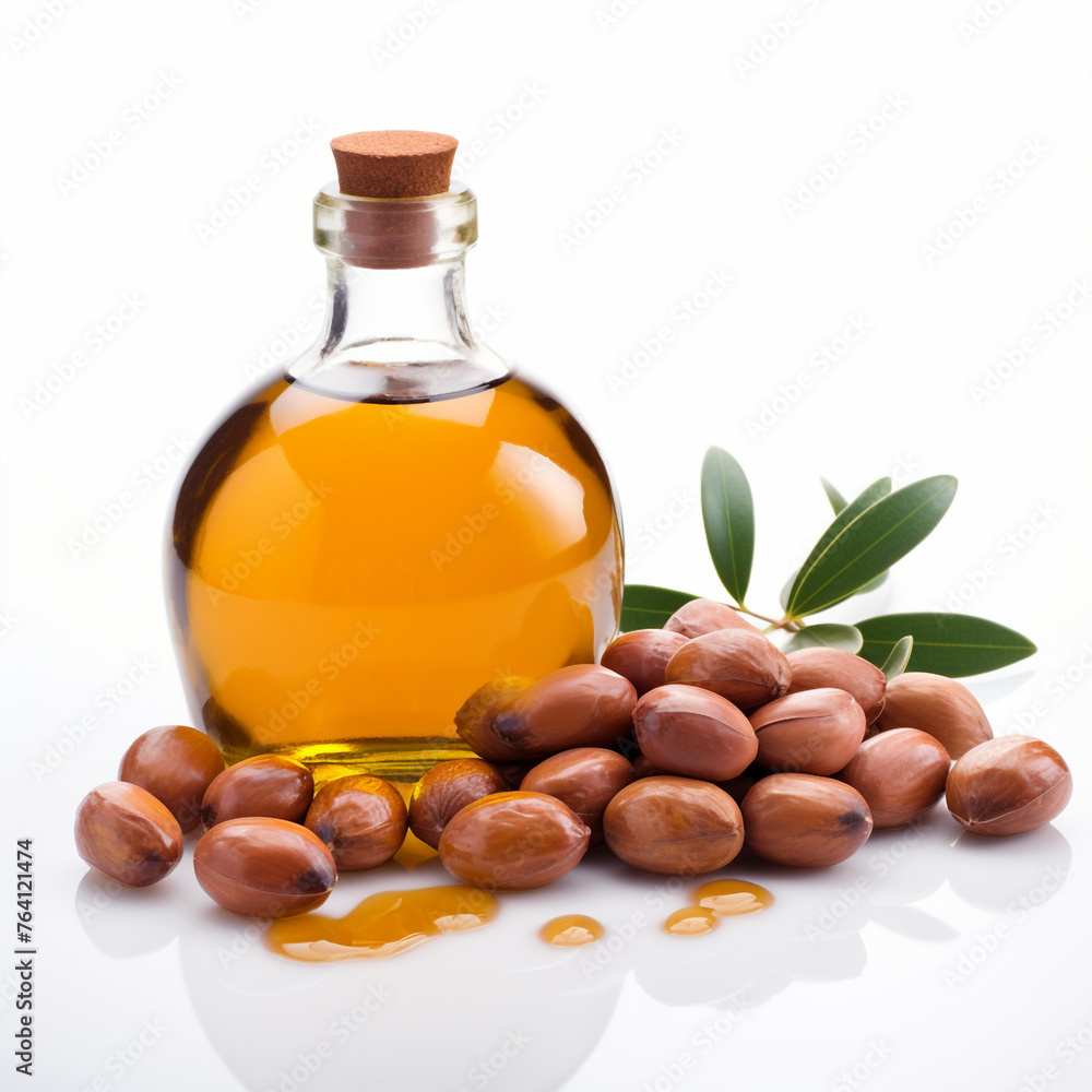 Bottle or flask of argan oil and argan seeds or fruits, isolated on white background. Bottle or flask of argan oil and argan seeds or fruits, isolated on white background.