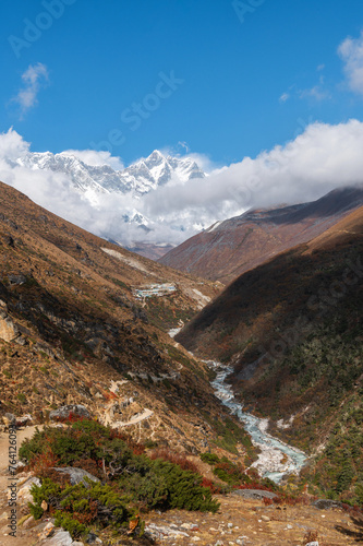 View of Nuptse, Everest and Lhotse mountains, Imja Khola river during trekking in Nepal. EBC Everest Base Camp or Three passes trek. Mountain range Himalayas, Pangboche village, Khumbu, Nepal, Asia.