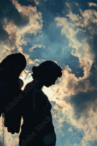 Angel Silhouette Praying Against Sky background with copy space. Silhouette of angel praying with a serene cloudy sky.