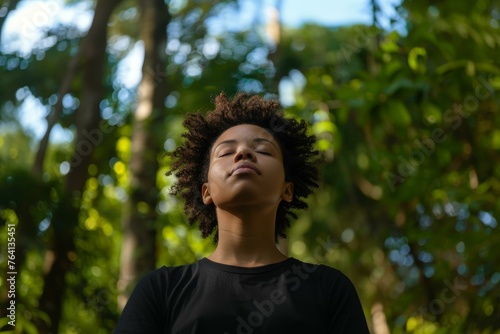 Woman enjoying a peaceful moment in a forest clearing