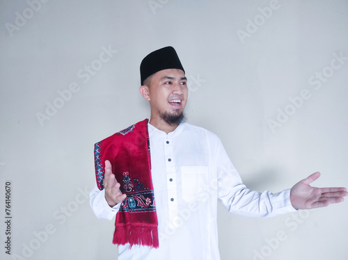 Moslem Asian man smiling happy with arms open photo