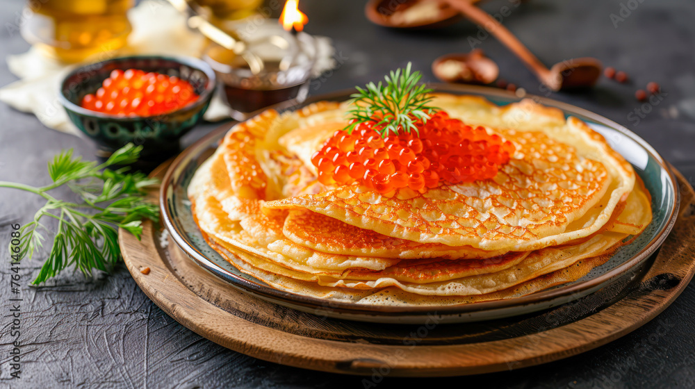 Traditional Russian Crepes Blini stacked in plate with red caviar on dark table for breakfast. Russian festival meal Maslenitsa or Shrovetide. traditional Russian blini recipe, restaurant menu Traditional Russian Crepes Blini stacked in plate with red caviar on dark table for breakfast. Russian festival meal Maslenitsa or Shrovetide. traditional Russian blini recipe, restaurant menu