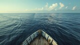 Gazing from the bow of a lone vessel, one witnesses the vastness of the open sea, highlighting the immense scale and solitude of maritime journeys.