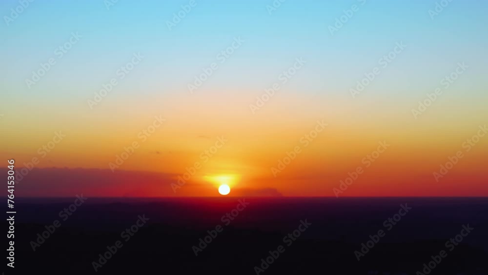 Bright dramatic sky with clouds over the Caribbean coast at sunset. Sunny tropical sunset landscape. Orange sun in a turquoise sky. Beautiful summer scenery Evening rays of the sunset. Bright dramatic sky with clouds over the Caribbean coast at sunset. Sunny tropical sunset landscape. Orange sun in a turquoise sky. Beautiful summer scenery Evening rays of the sunset.
