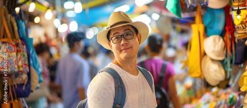 Man traveling backpacker on traditional market photo