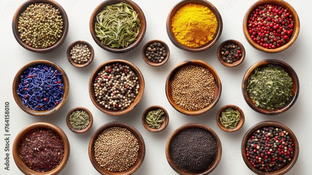 A top view of an assortment of spices, neatly organized in earthy ceramic bowls, showcasing the diversity and color of natural seasonings.