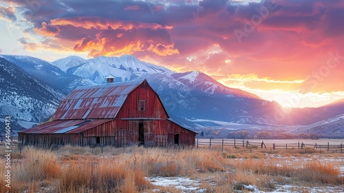 Rustic old barn basking in the golden light of mountain sunset