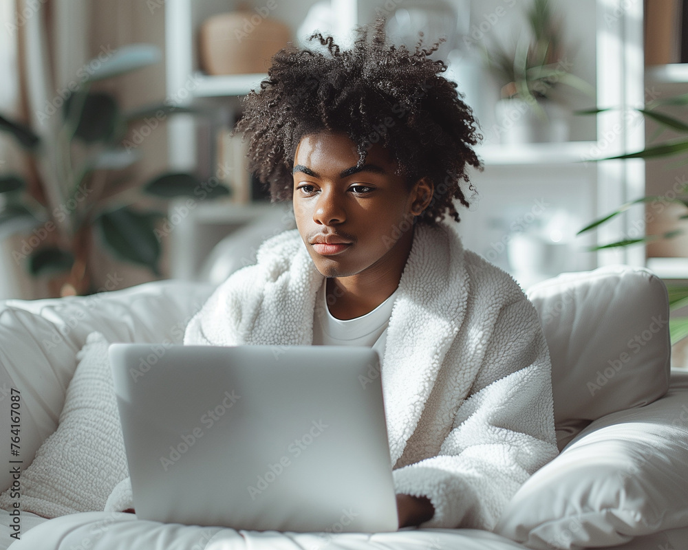 Young entrepreneur's bright, white workspace, minimal design, engaged with a laptop, startup vibe. Young entrepreneur's bright, white workspace, minimal design, engaged with a laptop, startup vibe.