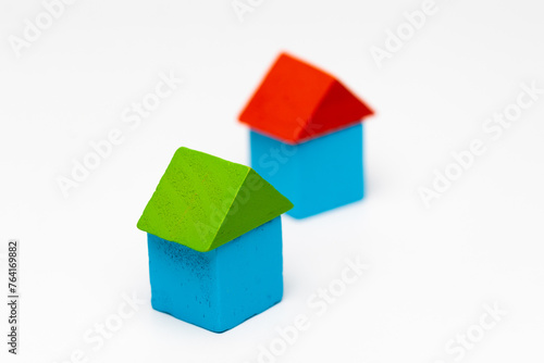House made of old cubes. Wooden colorful building blocks isolated on white background. Vintage children toys.